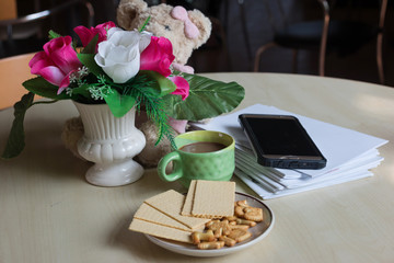 Coffee with  bread  in the morning on Desk for work
