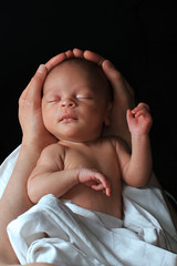 baby in mother's Arms stock photo