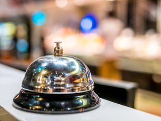 call bell service vintage bokeh background in restaurant and supermarket space colorful people blur.