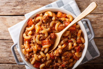 Homemade American goulash with elbow pasta, beef and tomatoes close-up. horizontal top view