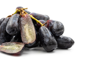 Black seedless moon drops grape or Witch fingers grape on white background