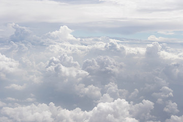 Naklejka na ściany i meble Beautiful clouds point of view On the plane window