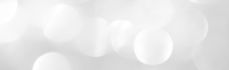 A brilliant blurry white background for a festive mood. Template for greeting card for entertainment.