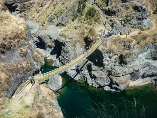 Fototapeta premium Q'eswachaca, a bridge made of grass, hanging over the Apurimac river, Quehue, Cusco, Peru
