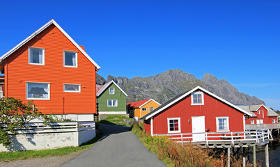 Fototapeta na wymiar Scenic view of colorful wooden rorbu houses, Henningsvaer, Lofoten Islands, Scandinavia, Norway. Henningsvaer is a fishing village located on Austvagoya Island