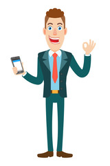 Fototapeta premium Businessman holding mobile phone and showing a okay hand sign