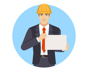 Businesswoman in construction helmet showing a paper