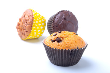 Assorted with Delicious homemade cupcakes with raisins and chocolate isolated on white background. Muffins. Top view.