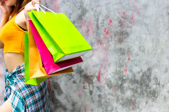 Beautiful Woman Is Shopaholic. Gorgeous Woman Can Not Restrain, Stop, Be Patient To Buy Goods, Brand Name Product That Shop Has Discount. Pretty Girl Holds Shopping Bags. She Love Shopping. Copy Space