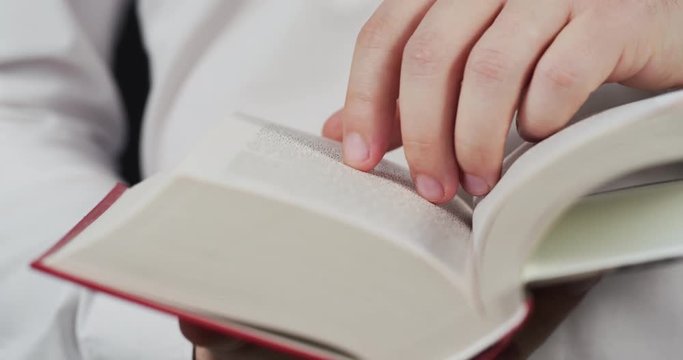 Close up of a person reading a book 