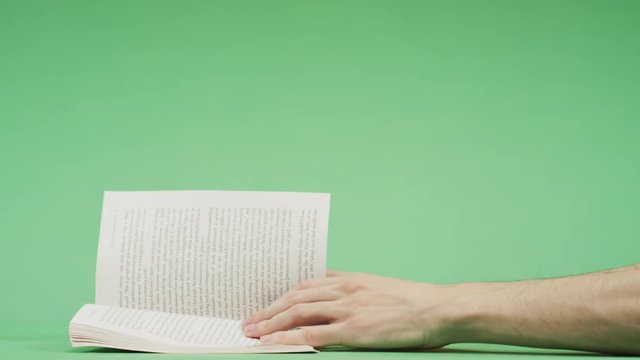 Reading a book and turning the page