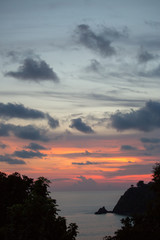 Fototapeta na wymiar Beautiful Beach Sunset with Ocean Waves and Dramatic Sky Clouds