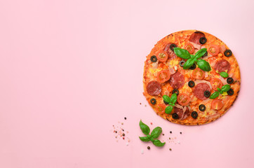 Delicious italian pizza, basil leaves, salt, pepper on pink background with copyspace. Top view. Banner. Pattern for minimal style. Pop art design, creative concept