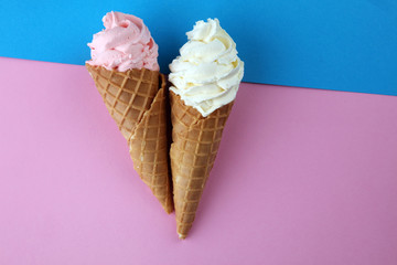 Vanilla frozen yogurt or soft ice cream in waffle cone.