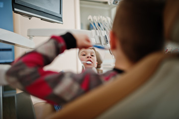 Little boy at dentist chair. Children dental.