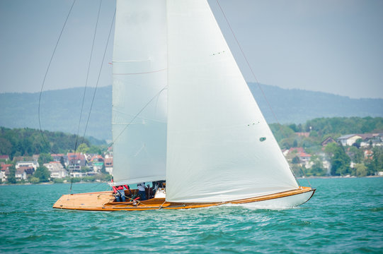 Classic sailing boats racing at a regatta at lake constance