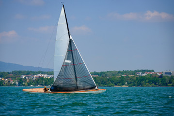 Classic sailing boats racing at a regatta at lake constance