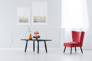 Black table and pink armchair