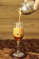 Iced coffee isolated on wooden background
