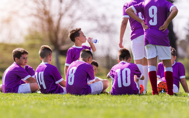 Young children players football match - waiting for match to start