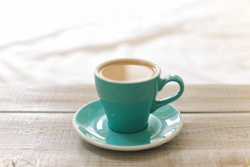 Hot coffee latte isolated on wooden table

