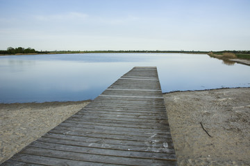 Wooden bridge to the lake