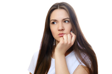 Fototapeta premium beautiful young woman on a white background, serious look, thinks, meditates