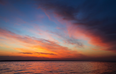 Magic orange sunset over sea. Sunrise over Beach