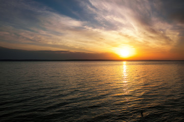 Beautiful fiery sunset sky on the beach. Composition of nature