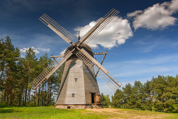 Original windmill from 19th century, dutch type The Folk Architecture Museum and Ethnographic Park in Olsztynek, Poland. - obrazy, fototapety, plakaty