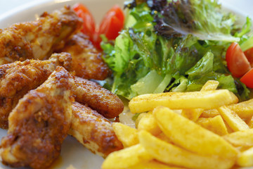Turkish style chicken wings served with potato fries and salad