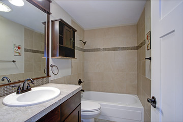 Classic bathroom with beige tile