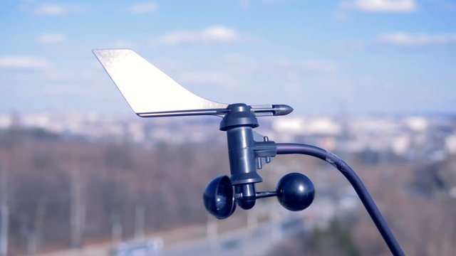 Special device indicates wind speed. Little anemometer rotates, indicating wind speed.