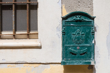 Green old mailbox. Castelsardo, Sardinia, Italy