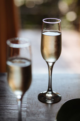Flutes filled with Prosecco Superiore Cartizze, an italian sparkling white wine, in a restaurant in Conegliano