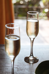 Flutes filled with Prosecco Superiore Cartizze, an italian sparkling white wine, in a restaurant in Conegliano