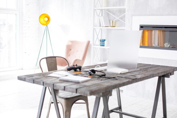 Cutting-edge technology. The photo of a hi-tech comfortable workplace of a gamer being equipped with a controller and a transparent display