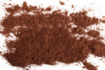 Cocoa powder pile isolated on white background, top view