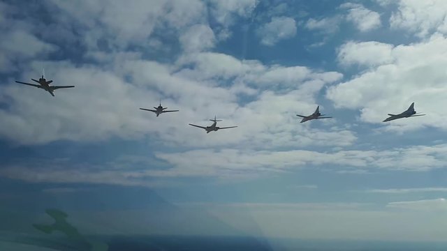 Five planes flying to the air show