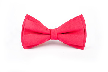 Bright pink bowtie on a white background.