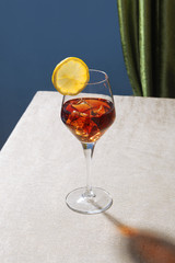 Spritz cocktail in a calix on a table, graphic