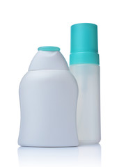Blank white mockup dispenser and figured bottles of cosmetic products with turquoise lids