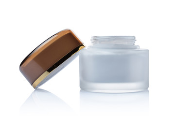 Opened glass white mockup jar of cosmetic facial cream with golden lid