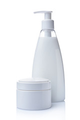 Blank white mockup jar and dispenser bottle of cosmetic products