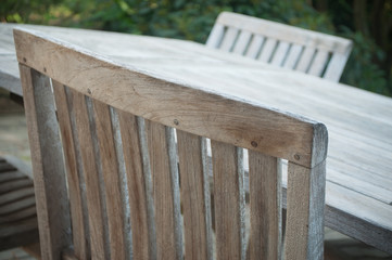 Fototapeta premium closeup of Teak garden furniture on a wooden terrace in spring