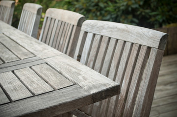 Fototapeta premium closeup of Teak garden furniture on a wooden terrace in spring