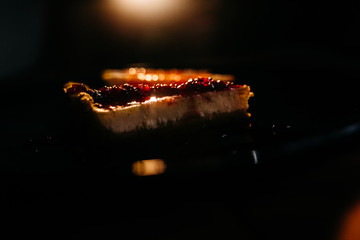 Cheesecake with grapefruit and chocolate on blue plate