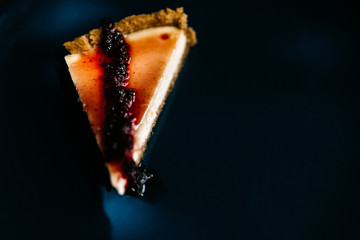 Cheesecake with grapefruit and chocolate on blue plate