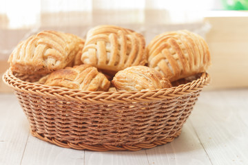 Cookies and sweet pastries with cross wired lines in basket