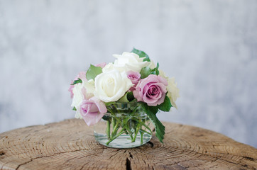 Flowers in a vase, beautiful roses fragrant, home cosiness